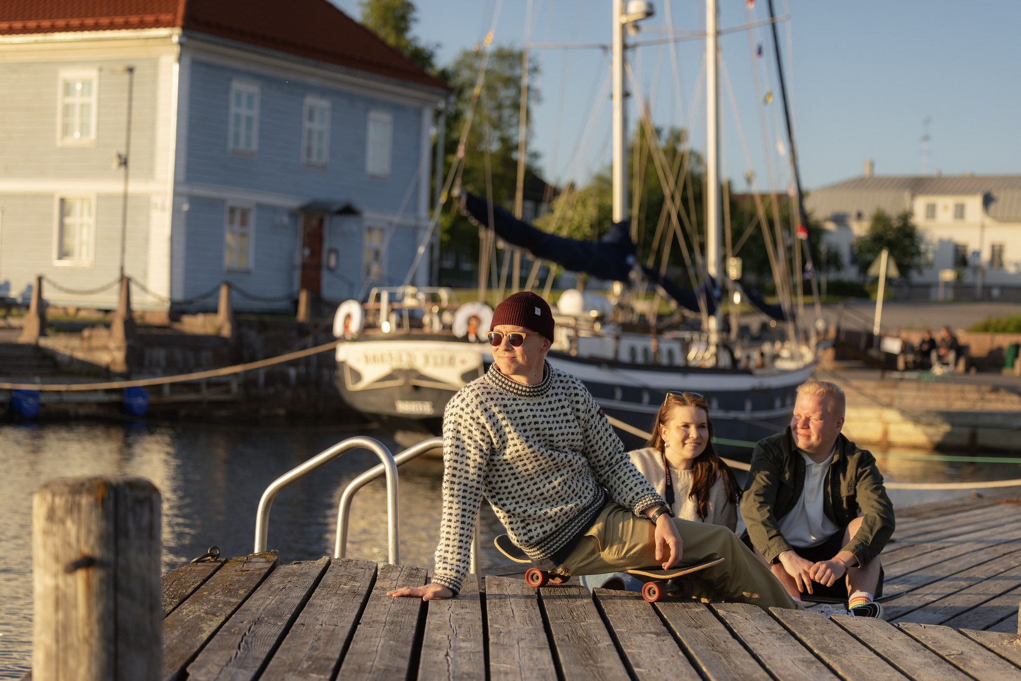 A group of friends enjoying a summer evening at the museum shore in Old Town Raahe.