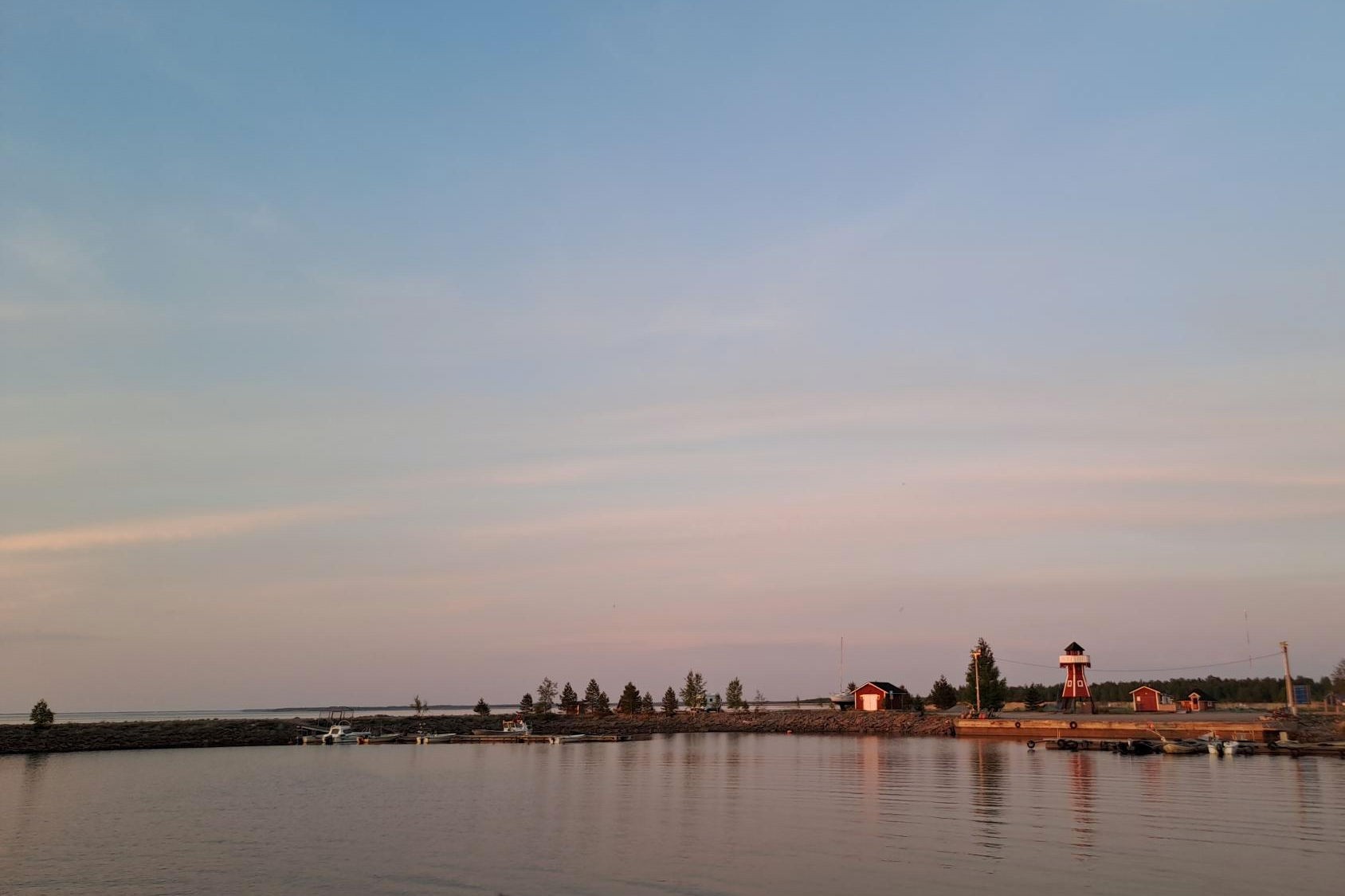 Varessäikkä beach in a sunset, pictured from the sea. 